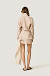 Beige loose dress with an asymmetric cut and flowing side detail